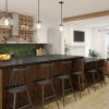 kitchen with a bar and chairs open to living room